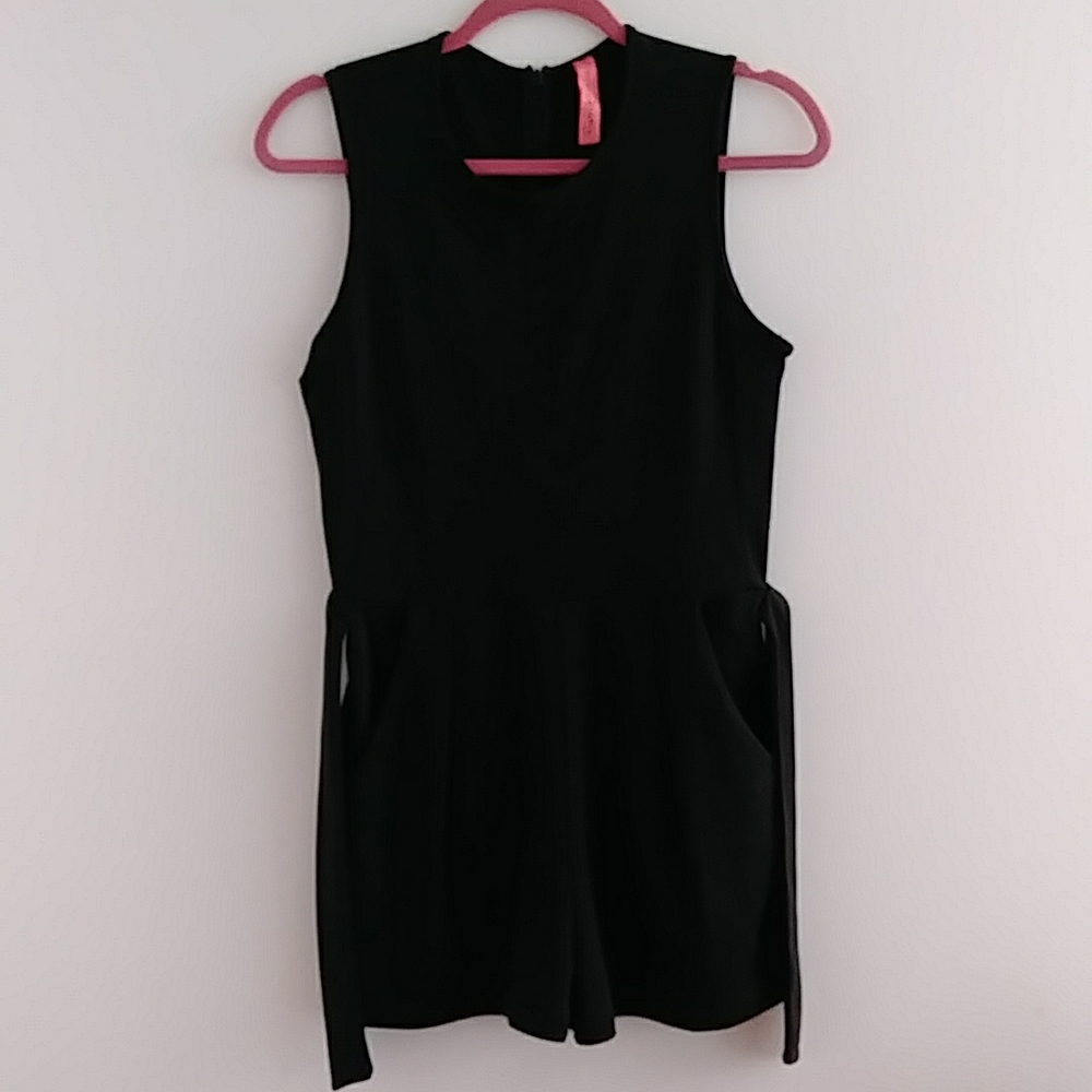 Cute,  belted Romper in a junior size medium